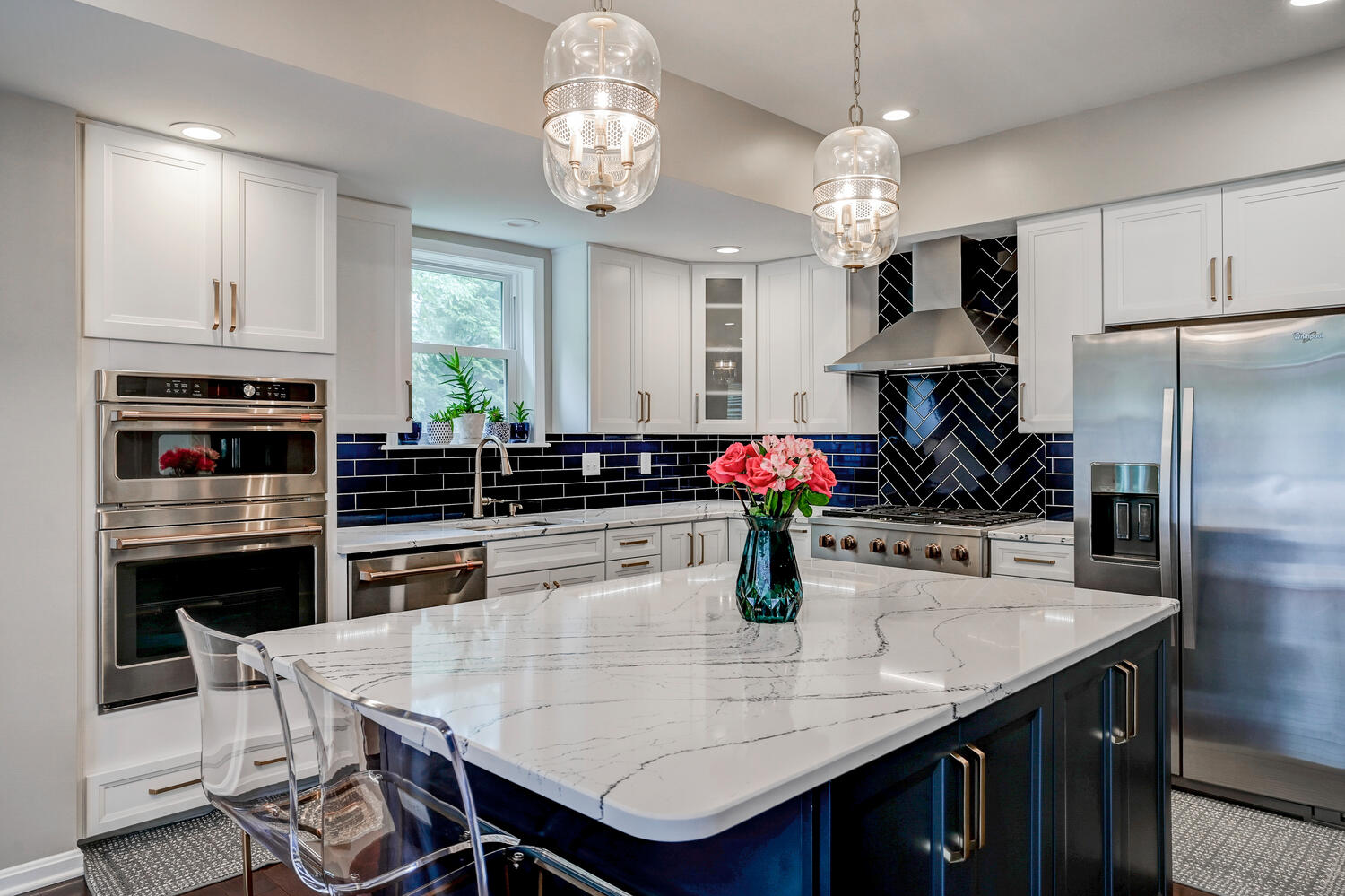 Modern kitchen with large island and pendant lights